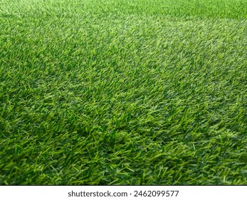 close-up view of artificial grass under midday sunlight. with selective focus