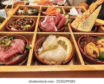 close-up view of assorted Japanese delicacies presented in traditional wooden bento box. The dishes include fresh sashimi, sushi, seafood such as shrimp, uni (sea urchin), scallops, tuna, and fish roe - Powered by Shutterstock