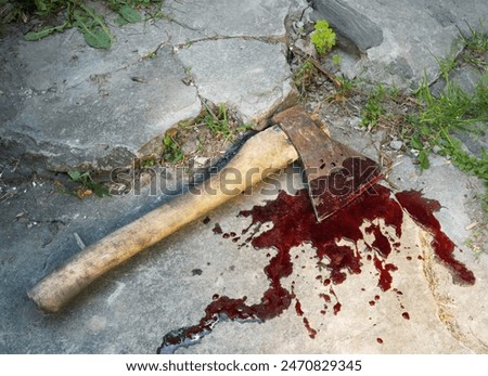 Closeup view attack heavy hard hit male human worker hand victim lay grass land crack stone rock floor. Evil anger fear creepy close up dirt red bleed splatter drip spot man body arm farm life scene