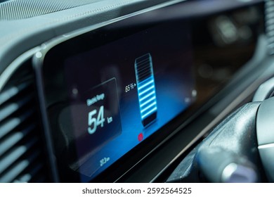 Close-up view of the battery indicator on an electric car dashboard.