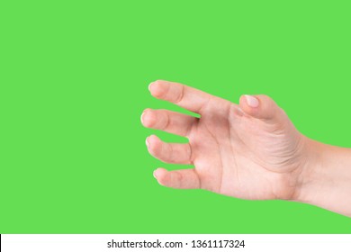 Closeup view of beautiful white female hand as if holding bottle or smartphone or other invisible object isolated on green chromakey background. Horizontal color photography. - Powered by Shutterstock