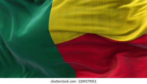 Close-up View Of The Benin National Flag Waving In The Wind. The Republic Of Benin Is A Country In West Africa. Fabric Textured Background. Selective Focus