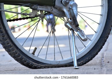 Closeup view of bicycle flat tire on pavement.