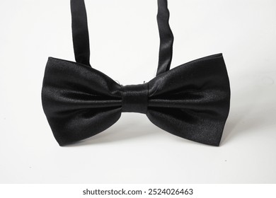 Close-up view of black bow tie, isolated on white background. - Powered by Shutterstock