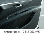 Closeup view of black car door inside modern automobile