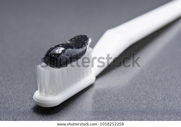 black close up toothpaste