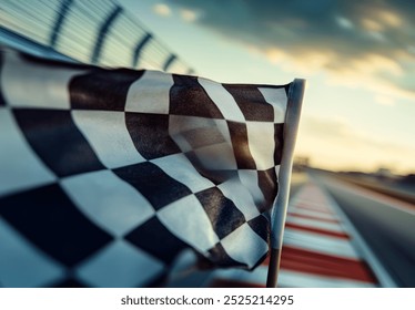 close-up view of a black and white checkered flag, symbolizing the end of a race, fluttering gently in the foreground