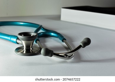 Close-up View Of A Blue Stethoscope, White Background