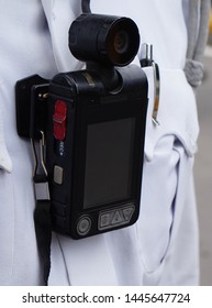 Closeup View Of A Body Worn Camera To Shoot Photo Or Video In Law And Order Enforcement By Indian Police Officer                                  