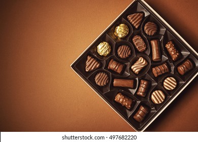 Closeup view of box of chocolates, view from above. 