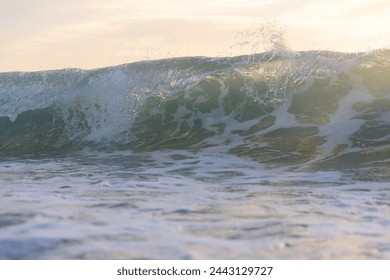 Close-up view of breaking wave in the ocean.