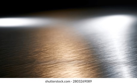 A close-up view of a brushed metallic surface with dramatic streaks of light reflecting across it, creating an abstract and modern aesthetic.