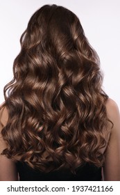 A Closeup View Of A Bunch Of Shiny Curls Brown Hair