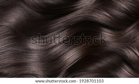 A closeup view of a bunch of shiny curls brown hair. ストックフォト © 