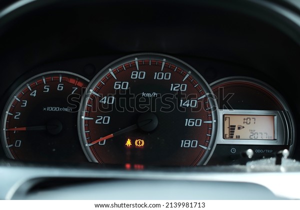 Close-up view of car panel with speedometer showing\
speed 0 km per hour