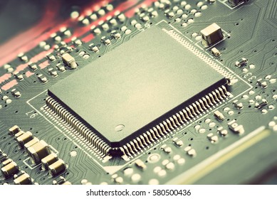 Closeup view of a central processing unit or CPU on electronic board. CPU is electronic circuit within a computer that caries out the instructions of a computer program by performing basic arithmetic.