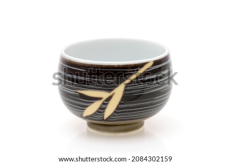 closeup view of ceramic cup for tea on white background  