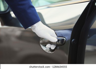 Closeup View Of Chauffeur Opening Car Door