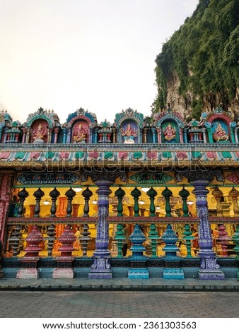 Closeup view of Colorful Hindu Temple with limestone hill on the background, near Kuala Lumpur, Malaysia.