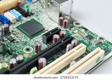 Close-up view of a complex computer motherboard with various electronic components and connectors