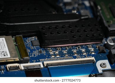 Close-up view of a complex computer motherboard showing intricate circuitry and electronic components for advanced technology and innovation
