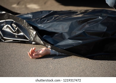 Close-up View Of Corpse On Road After Traffic Collision