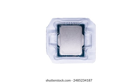 A close-up view of a CPU processor in protective packaging. The processor is a silver square, surrounded by transparent plastic tray.