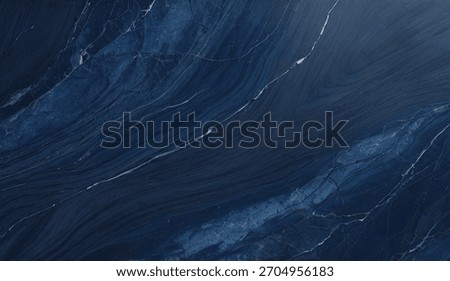 A close-up view of a deep navy blue marble surface, showcasing intricate white veins and a smooth finish. Perfect for backgrounds, interior design, luxury projects.