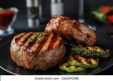 Closeup view of delicious grilled beef medallions served on table