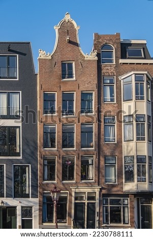 Beautiful Architecture Of Dutch Houses On Amsterdam Canal In Autumn