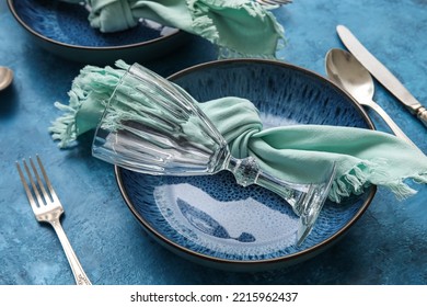 Closeup View Of Dinnerware On Blue Table