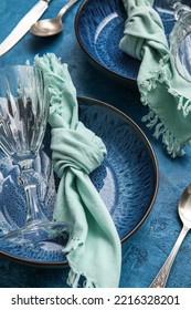 Closeup View Of Dinnerware On Blue Table