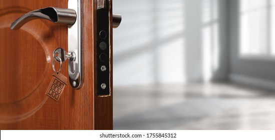 Closeup View Of Door With Key Open Into Empty Room