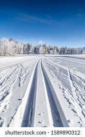 Close-up view of empty cross-country skiing track in beautiful winter wonderland scenery