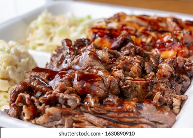 A Closeup View Of An Entree Of Teriyaki Beef And Chicken In A Restaurant Or Kitchen Setting.