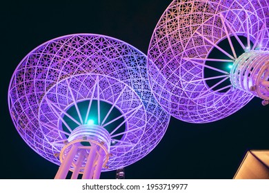 Close-up View Of A Famous Dubai Tourist Attraction - Futuristic Glowing Metal Super Trees On Bluewaters Island. Travel Destinations And Technologies Concept