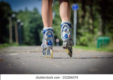 Close-up View Of Female Legs In Roller Blades