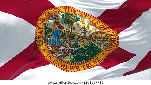 Close-up view of the Florida state flag\
waving. Florida is a state located in the Southeastern region of\
the United States. Fabric textured\
background