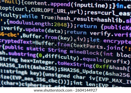 Close-up view of a focused computer screen displaying JavaScript code, with highlighted functions Depth of field creates an impression of gazing towards the legible text in midground Possibly taken