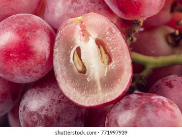 close-up view of fresh red grape isolated on white background.