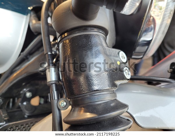 A closeup\
view of the front end of a motorcycle.\
