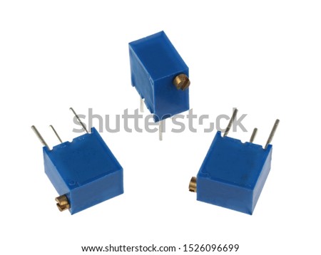 Close-up view of a group of adjustable trimmer potentiometers, isolated on a white background         