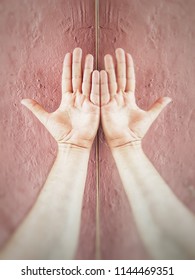 Close-up view of a hand with  reflection in mirror 