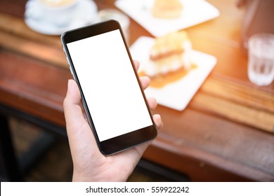 Close-up View Of Hand Using Mobile Phone With Blank Screen