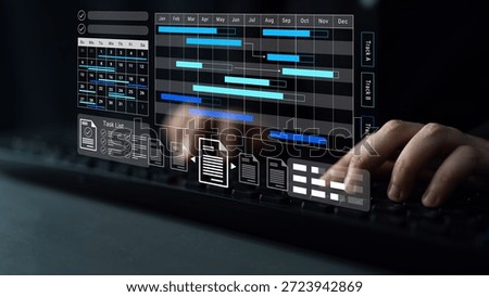A close-up view of hands operating a digital project management tool featuring an interactive Gantt chart and task list, reflecting modern workspace efficiency and technology use. Gantry