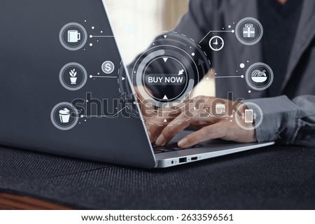 Close-up view of hands using a laptop to navigate an e-commerce platform with digital shopping icons and buttons, illustrating technology in modern retail.