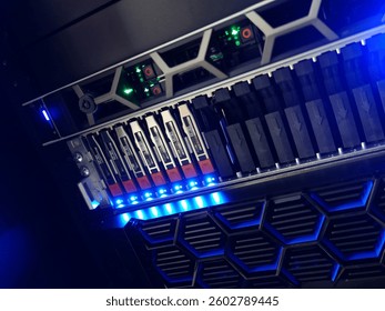 Close-up view of a high-performance server storage unit featuring LED lighting and advanced technology for optimal data management in modern computing environments.
