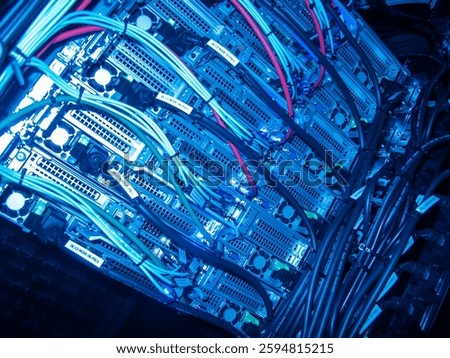 A close-up view of a high-tech server rack showcasing colorful cables and cooling systems. This image represents modern computing technology and infrastructure.
