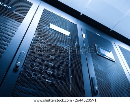 A close-up view of a high-tech server rack in a modern data center, showcasing advanced technology and organization of equipment for efficient data management.