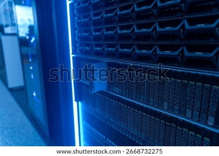 A close-up view of a high-tech server rack in a modern data center. The image showcases the intricate design, cooling solutions, and organized storage systems essential for data management.
